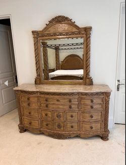 Ashley Furniture South Coast Marble Top Dress with Mirror.  In very good condition with no major signs of wear.  73"w x 18"d x 38"H Height including m