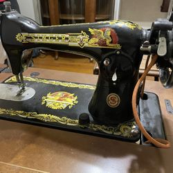 Two antique sewing machine machines
