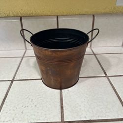 Small rustic metal bucket with handles