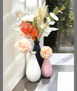 Set of 3 modern ceramic bulb vases in black, white, and pink 