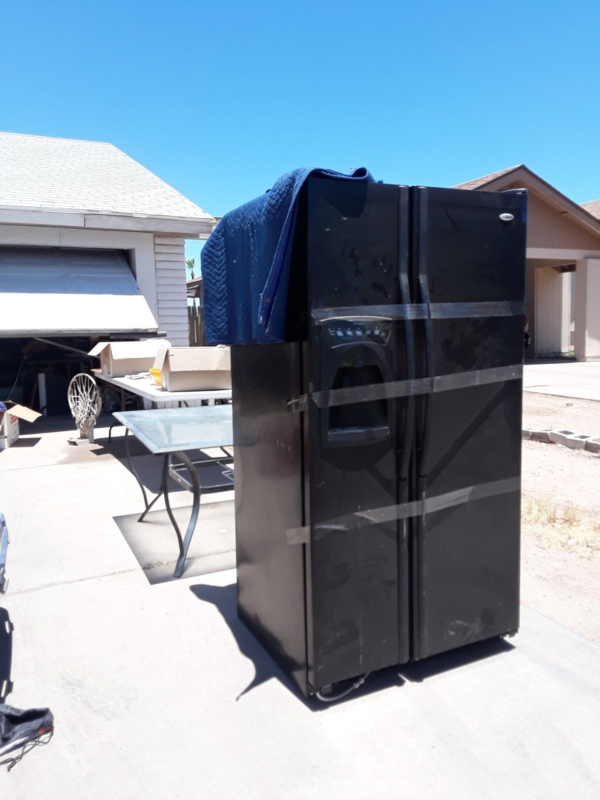 Black Amana fridge with Ice machine and filtered water dispenser for