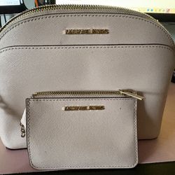 Michael Kors pink purse with wallet. 