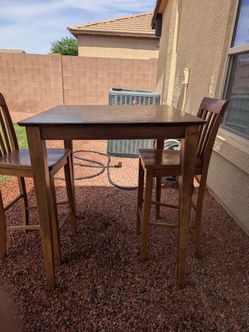 Wooden high top with chairs