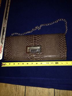 Brown purse gold chain and latch