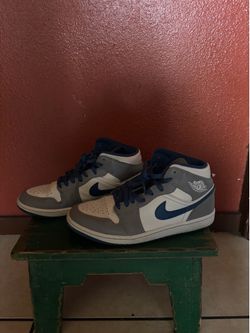Authentic Nike Air Jordan 1 Mid sneakers in the "True Blue" colorway