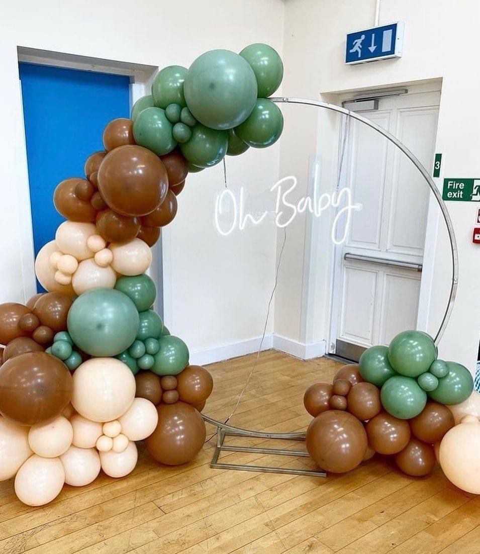 Balloon decorated circle arch with Oh baby LED sign