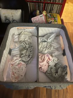 Clean like new twin bassinet for your little ones. Has two separate sleeping areas. Convenient side pockets for storage. With sheets. only used a few 