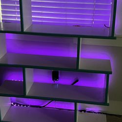 bookcase — staggered 4 shelves, teal/white, color changing lights