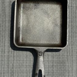 Griswold vintage square cast-iron skillet number three selling on eBay for over $400