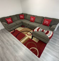 Beautiful 3-Piece Gray Sectional Sofa with chaise. Ashley Furniture. Delivery available for an additional cost.