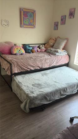 Twin  2 day beds and 2 mattresses semi new