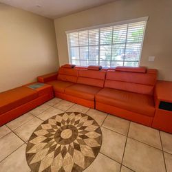 Orange Leather couch + ottoman

