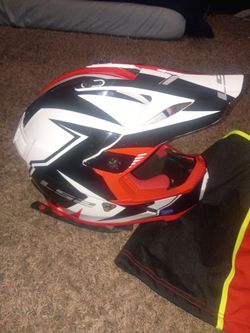 Red white and black LS2 helmet