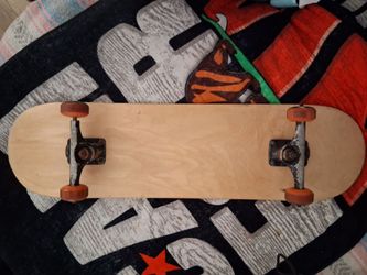 Blank skateboard deck with Tensor trucks