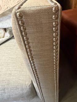 Upholstered couch with Nailhead Trim