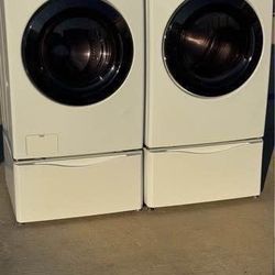 Front load kenmore  washer and front load kenmore  dryer electric high efficiency with pedestals  working excellent  with warranty  extra for delivery