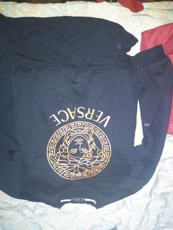 Versace sweater minor flaws stains on sweater don't know how to get them out.selling for the low