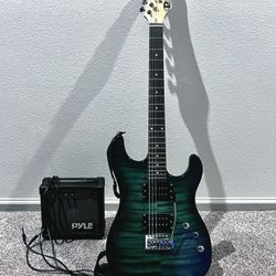Electric Guitar With Cord And Small Amp 
