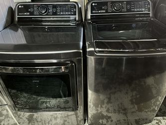 LG 5.7 Cu.ft. Mega Capacity Top Load Turbowash Washer + LG 7.3 cu. ft. Ultra Large Capacity TurboSteam Electric Dryer with EasyLoad Door.