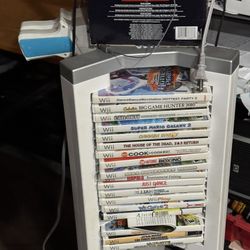 Older Wii Console With Games And Controllers