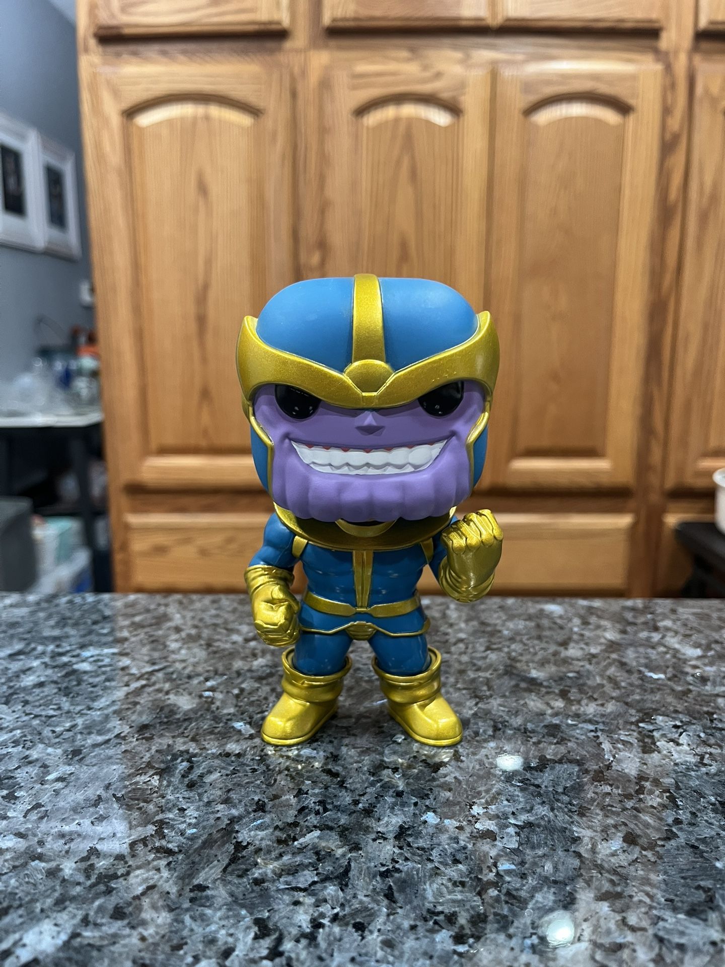 Vinyl Toy Funko Pop! Marvel Christmas Sweater Thanos Bobblehead.  Approximately 5 inches tall.  Preowned.  Has been on display in a cabinet with a lar