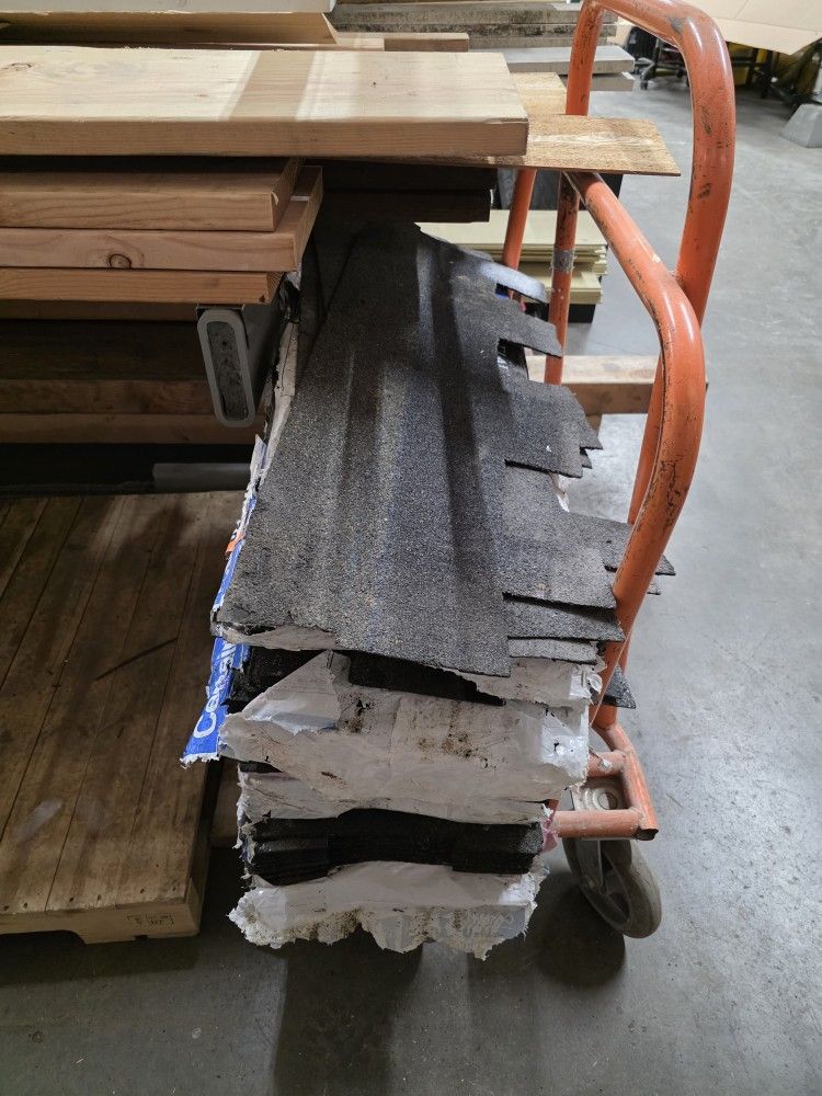 LEFT OVER ROOF SHINGLES APPROXIMATELY 4-5 PACKS