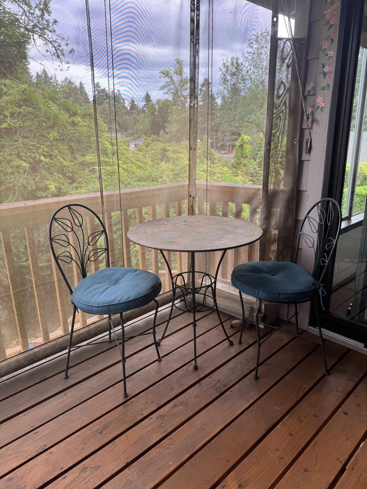 Table and Two Chairs With Cushions