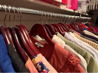 Closet-worth of cherry wood hangers