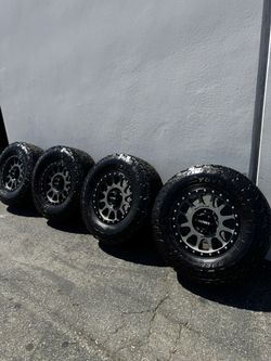 FINANCING AVAILABLE 8x6.5 Method MR305 18” Wheels Titanium With Toyo AT3 All-Terrain Tires