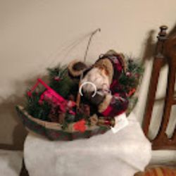 Santa In His Canoe (Not a Toy)