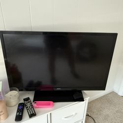 TV with Roku Box And Remotes