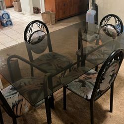 Glass Table A Non-Scratched Glass Table With Four Chairs