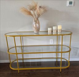 3-Tier TV Stand or Console Table with decorations.