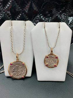 Couple Atocha silver coin pendants in gold bezel with silver rope chain