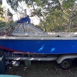 Boat, With Broken Motor And Trailer