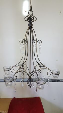 Unique vintage rod iron candle chandelier. Can hold 6 candles. Like new been in storage. Sold for over 100. Asking 30
