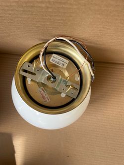Globe ceiling light fixture with brass base