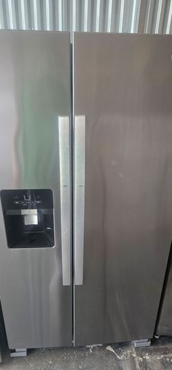 Newer Whirlpool Stainless Side-by-Side Refrigerator With Ice And Water Plugged In Cold