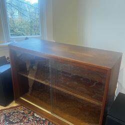 Mid-century teak media console with sliding glass doors