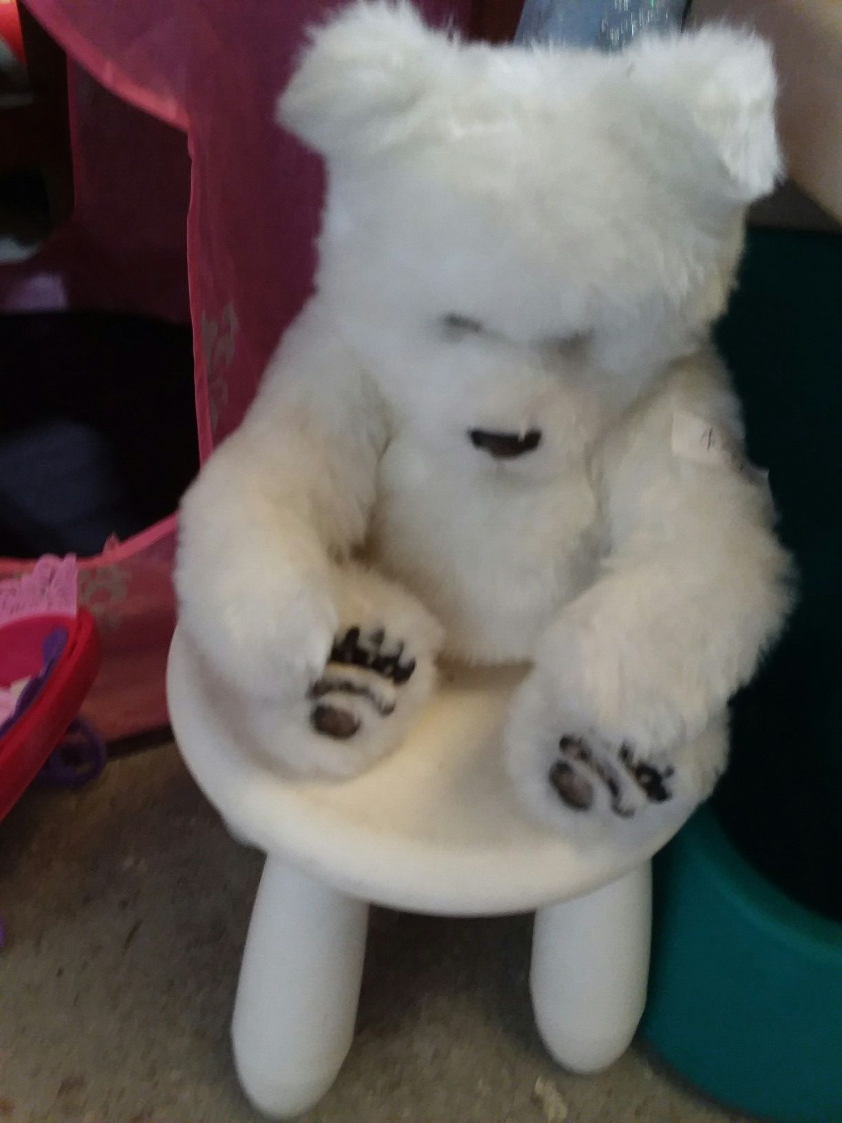 Bear , he moves arms to hug you and makes hugging sound , squinches his nose arms move, addorable!