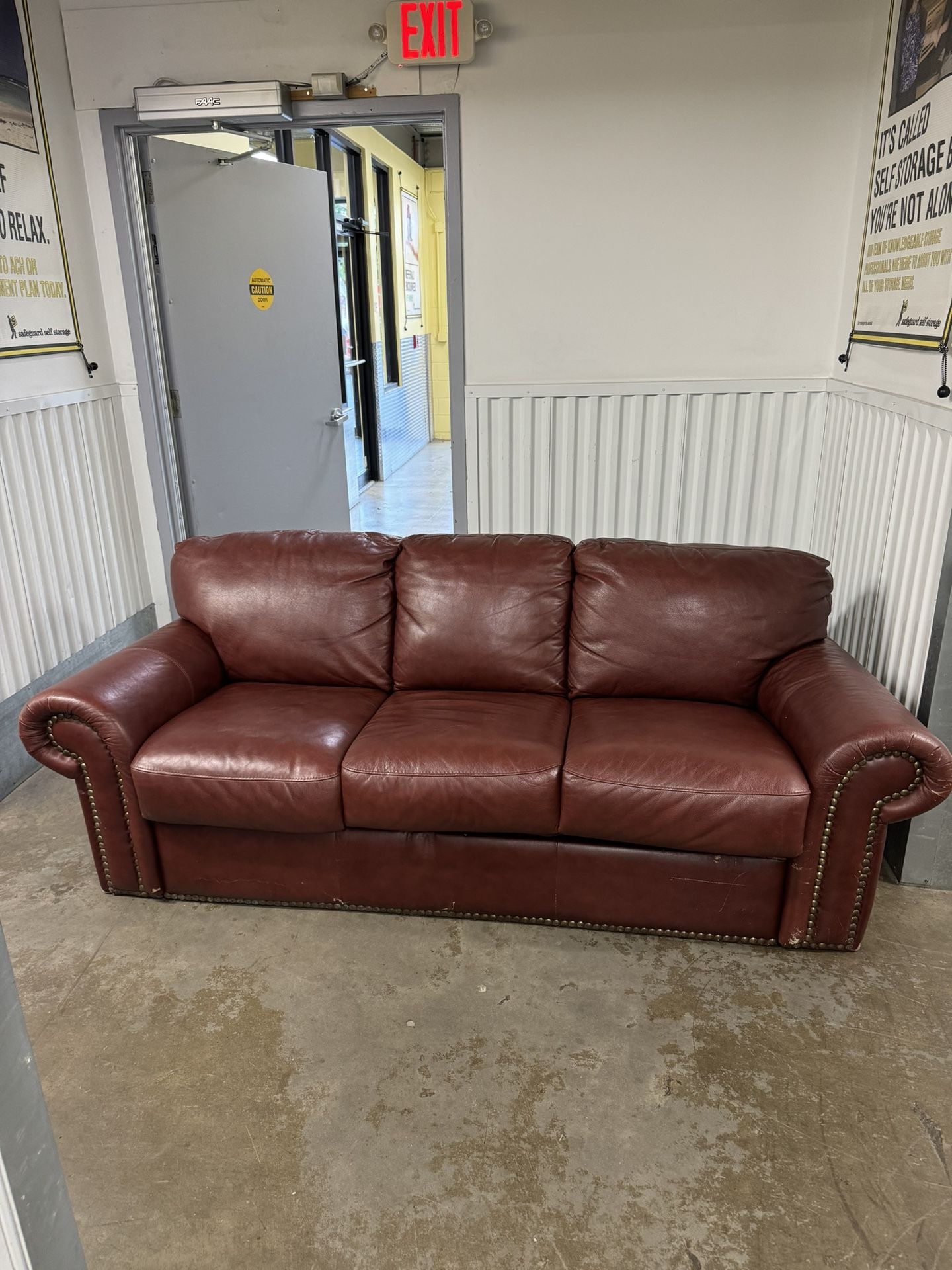Leather Sofa W/ Pull Out Bed. 