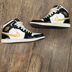 Gold, white, black Jordan 1s