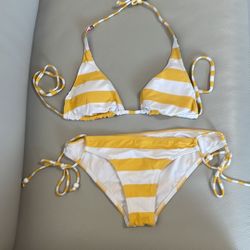 Ripcurl swimsuit 2 piece bikini yellow white stripe medium bottom with side tie  34C triangle top. Top has two sides. Worn a few times