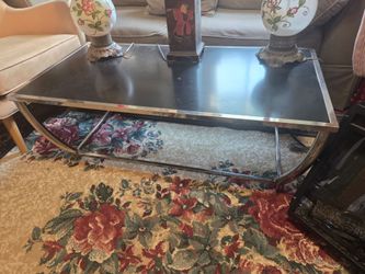 Coffee table Chrome and Black Coffee Table 48 x 24 n 18 inch tall.$65  Lamps budha 85 each