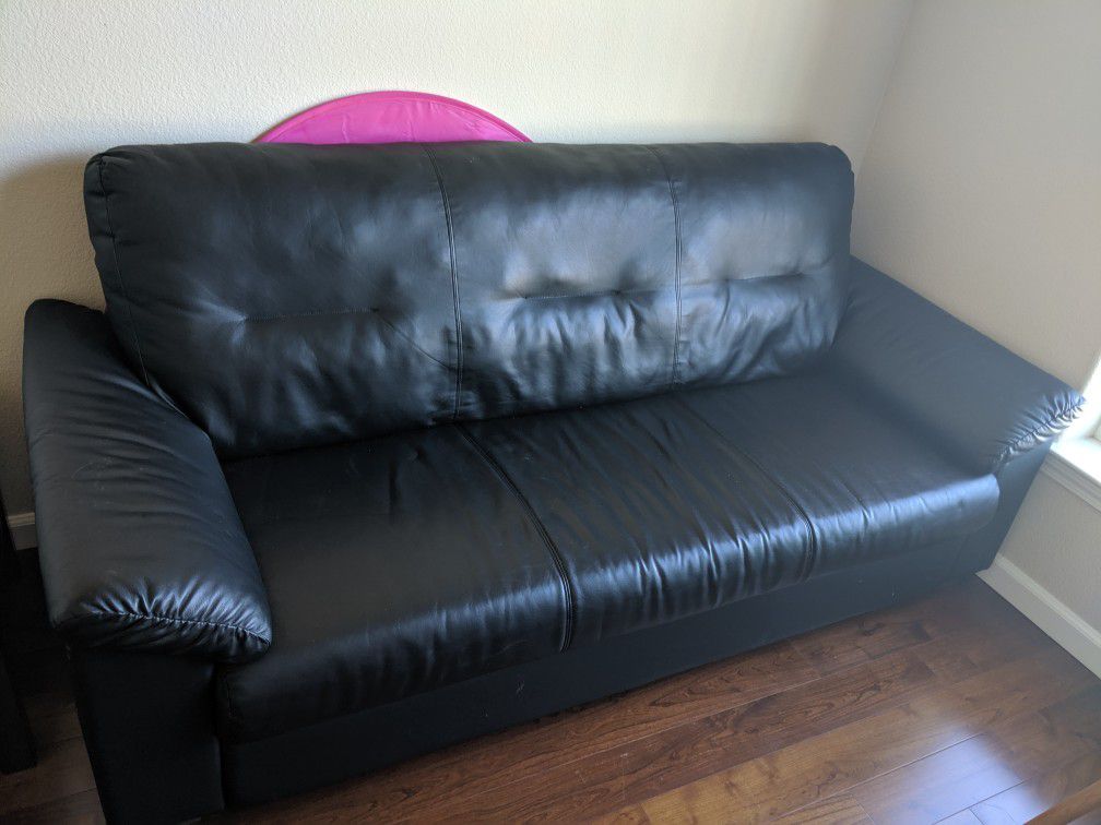 Ikea black faux leather 3seat sofa with a ikea black coffee table