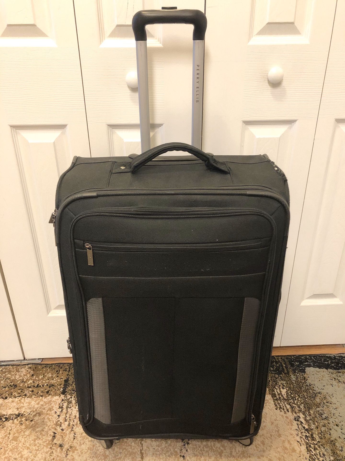 Perry Ellis 30” suitcase rolling luggage expandable
