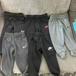 5 Pairs Of Nike Pants, 1 Pair Of Under armor, 1 Nike Shirt 