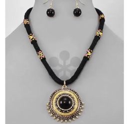 Black and yellow ethnic round pendant necklace