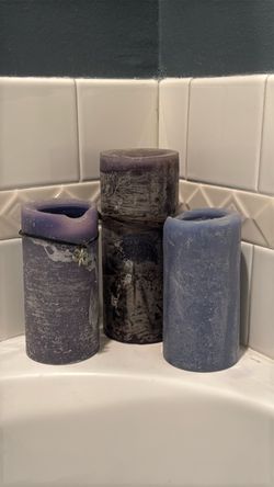 Halloween or spa bath purple and dark blue candles