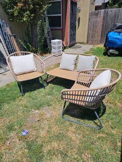 Wicker and metal patio set. In good condition